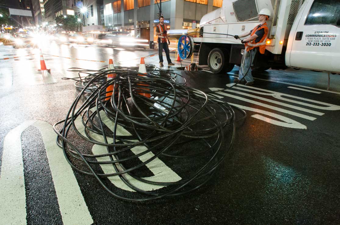 Fiber Crew installing fiber cable underneath the streets of Manhattan.